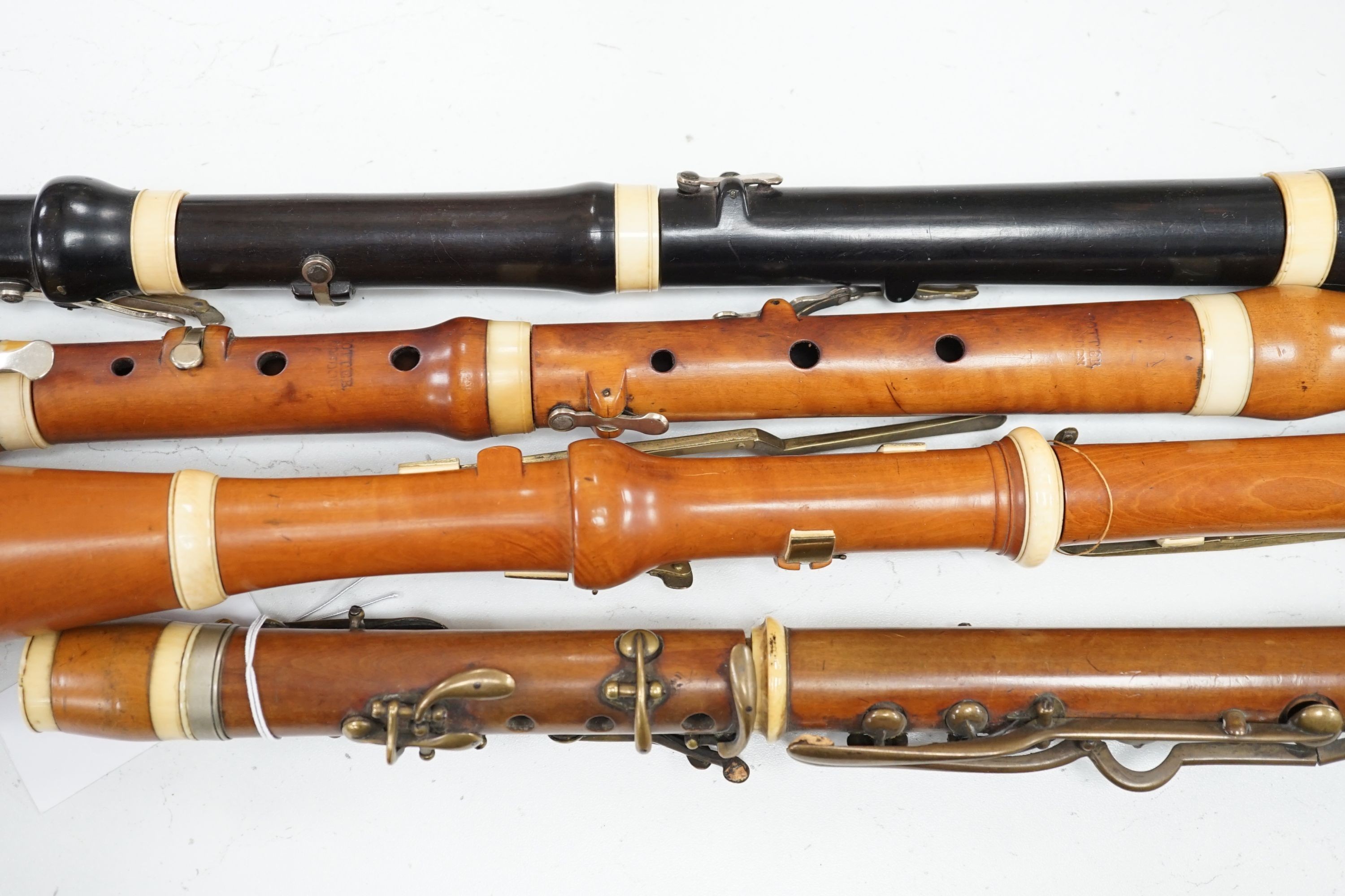 Two 19th century flutes by W. Potter, one in boxwood, the other ebony, and two 19th century boxwood clarinets, one by Dollard, the other by Lazarus
